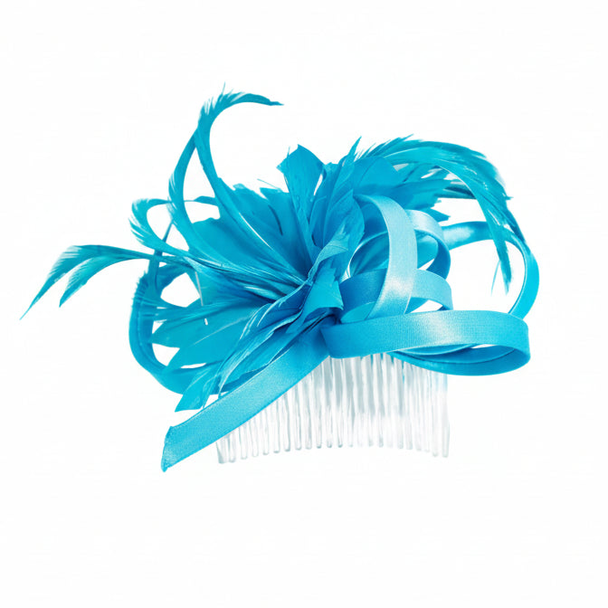 Turquoise fascinator on white background