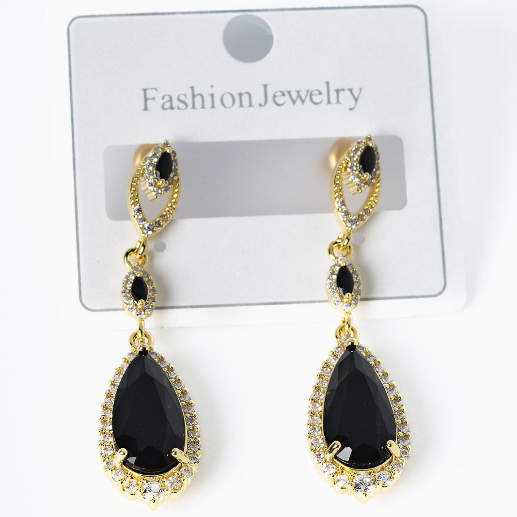 Black teardrop earrings with gold accents 